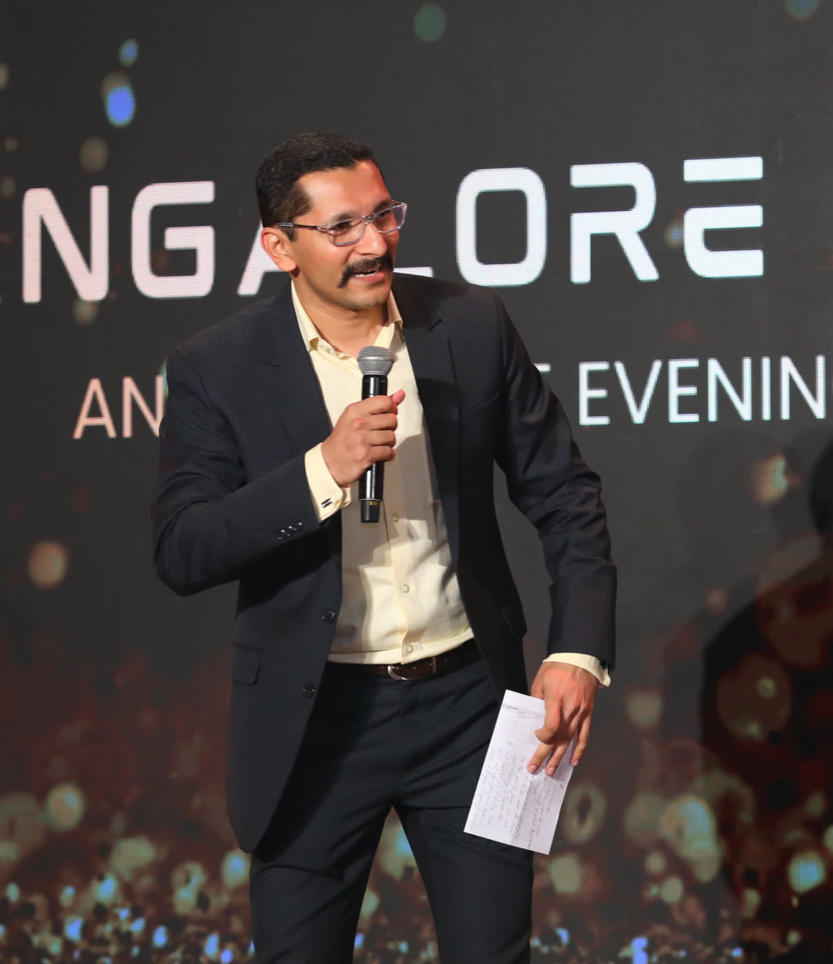 Chinmay hosting an evening event in Bangalore